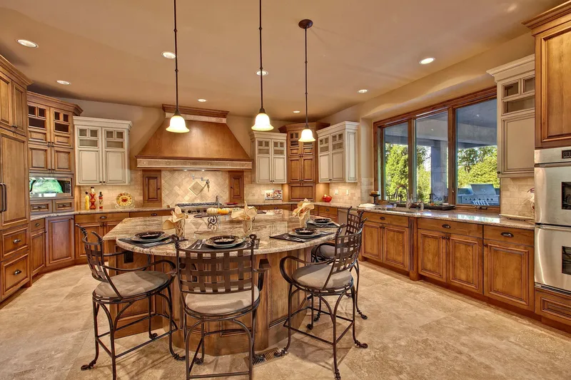 Bear Creek: Kitchen with a broad island and wood cabinetry