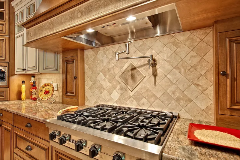 Bear Creek: Cooktop and patterned tile backsplash