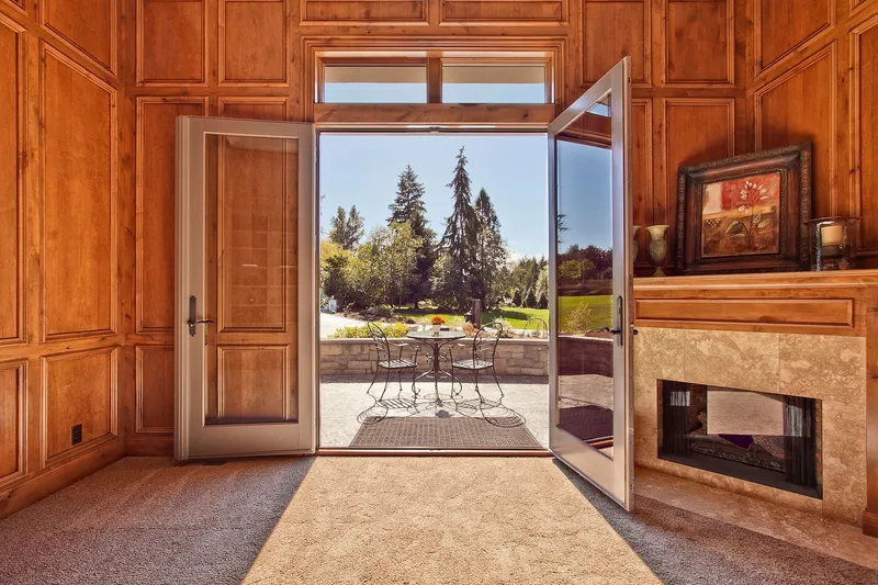 Bear Creek: Wood-paneled study opening to the terrace