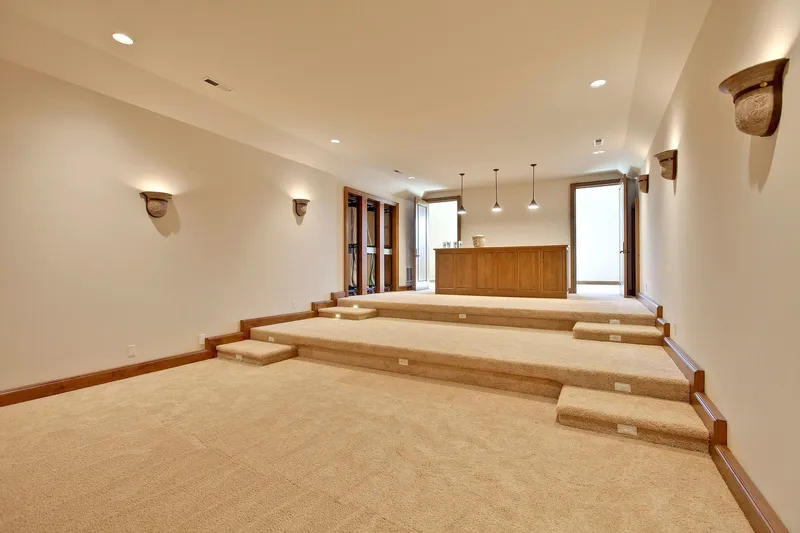 Bear Creek: Tiered media room looking toward a counter