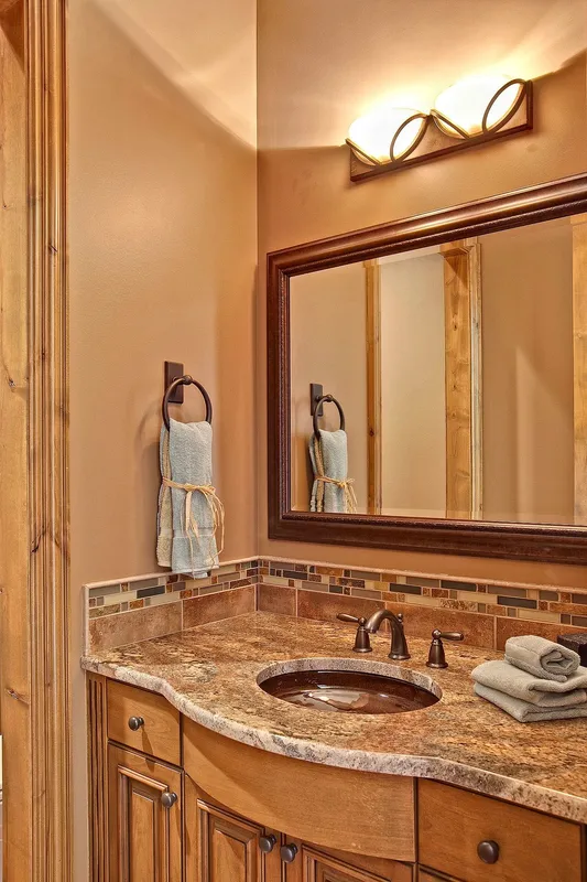 Bear Creek: Powder-room vanity and framed mirror