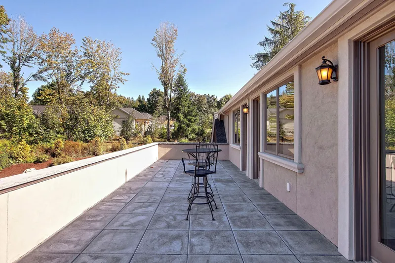 Bear Creek: Long paved terrace beside the home