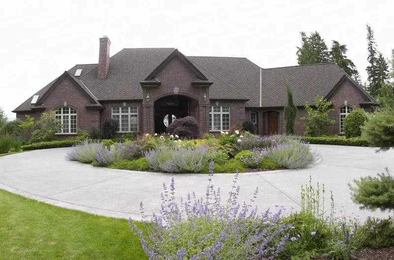 Duvall Valley: Front exterior across the circular drive and planting beds