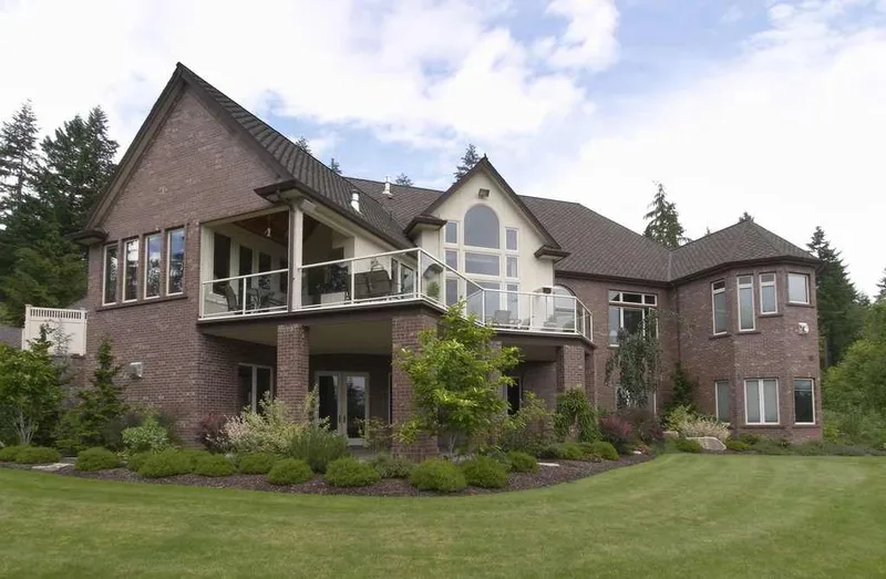 Duvall Valley: Rear exterior with stacked outdoor spaces and tall windows