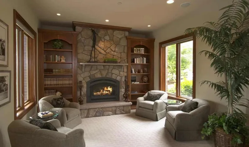 Duvall Valley: Sitting area with a stone fireplace and built-in shelves