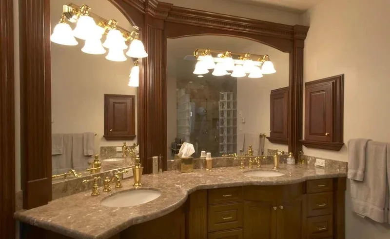 Duvall Valley: Bathroom with paired sinks and a wood-framed mirror