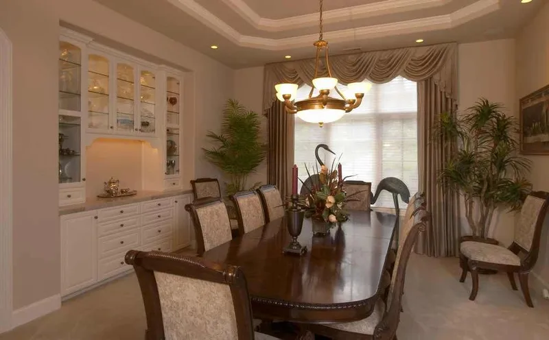 Duvall Valley: Dining room with a chandelier and built-in cabinetry
