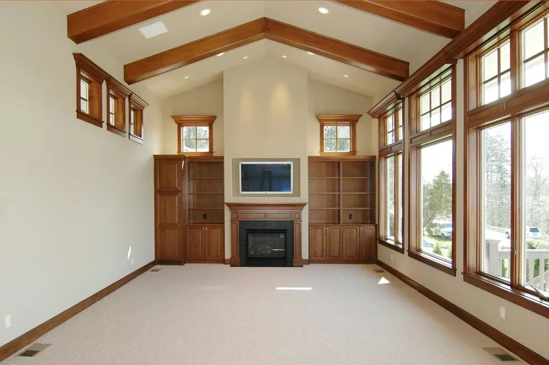 Eagle Shores, Lot 2: Great room with ceiling beams, a fireplace and built-ins