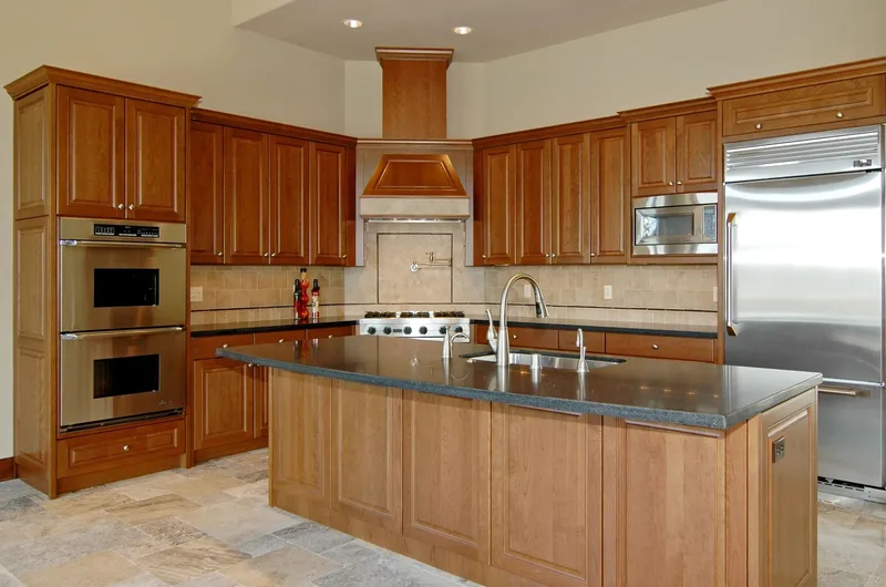Eagle Shores, Lot 2: Wood-cabinet kitchen with an island