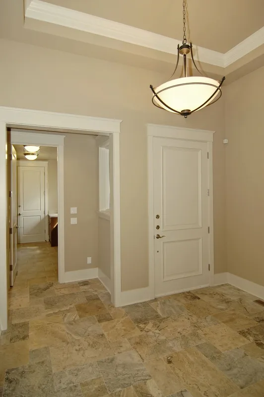Eagle Shores, Lot 2: Entry hall with stone flooring and a pendant light