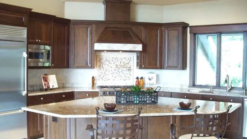 Eagle Shores, Lot 3: Kitchen island facing the range and cabinetry