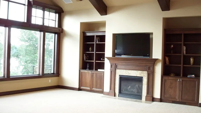 Eagle Shores, Lot 3: Great-room fireplace beside tall windows