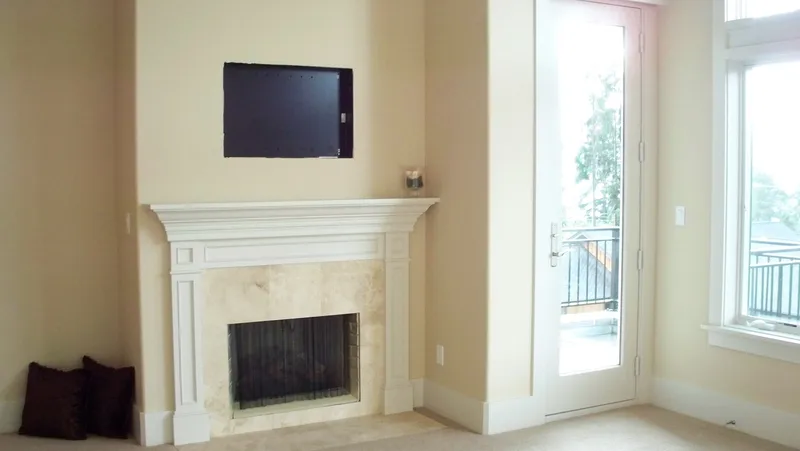 Eagle Shores, Lot 3: White fireplace beside glazed doors