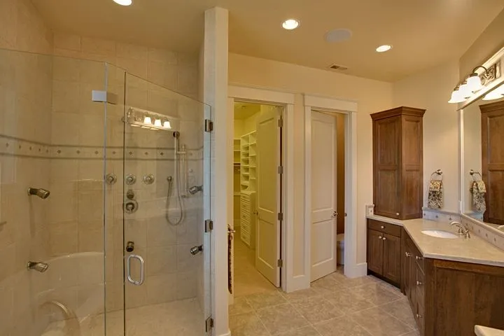 Eagle Shores, Lot 3: Glass shower and adjacent bathroom vanity