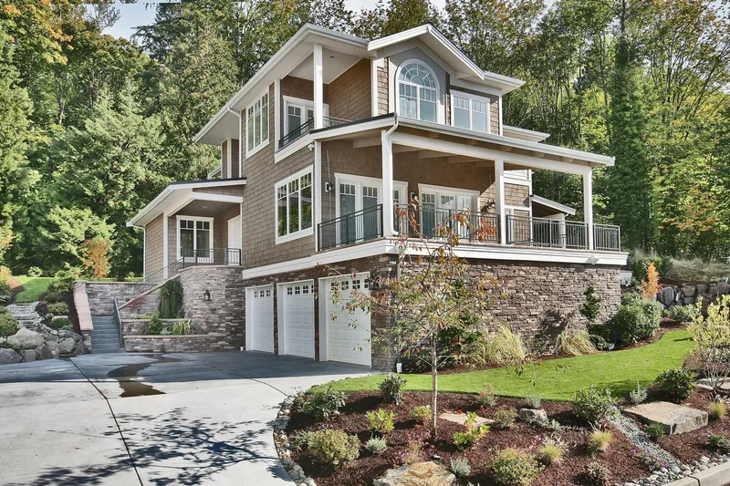 Eagle Shores, Lot 4: Front exterior with covered balconies and landscaped grounds