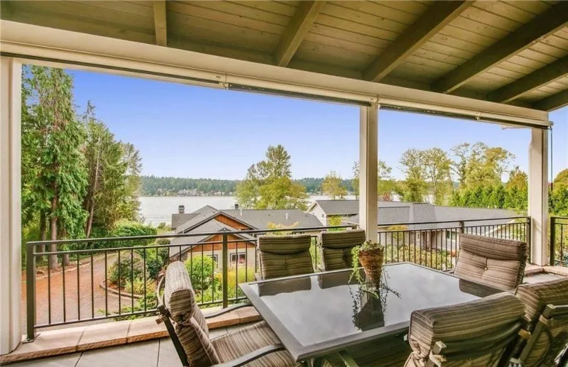 Eagle Shores, Lot 4: Covered balcony with outdoor seating and lake views