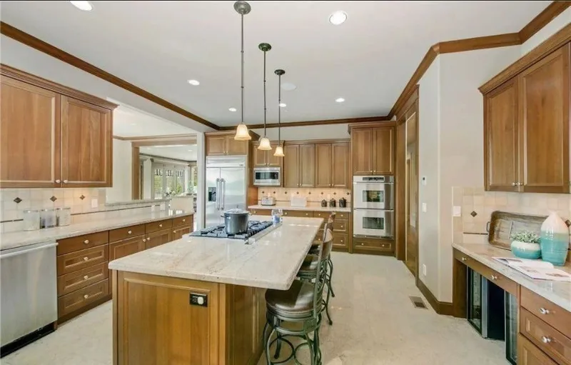 Eagle Shores, Lot 4: Kitchen with a central island and wood cabinetry