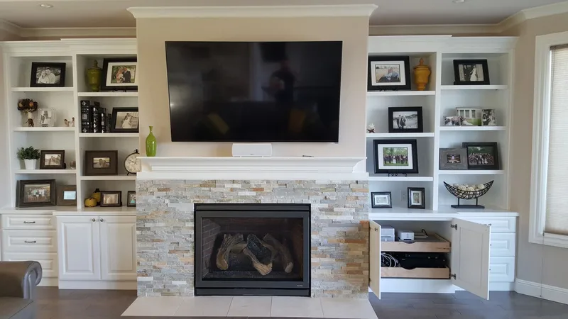 Issaquah Highlands: Living room fireplace framed by built-in shelves