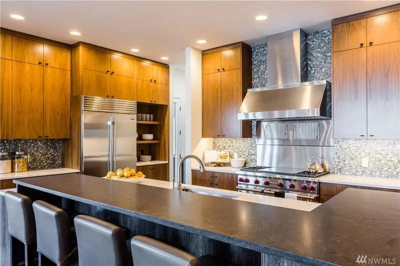 Lake Washington, Madrona: Kitchen island, range and wood cabinetry