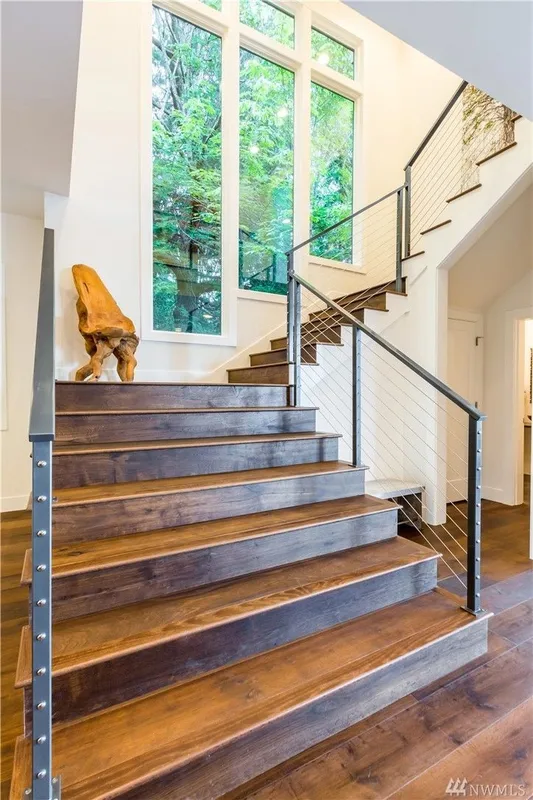 Lake Washington, Madrona: Wood staircase beside tall windows