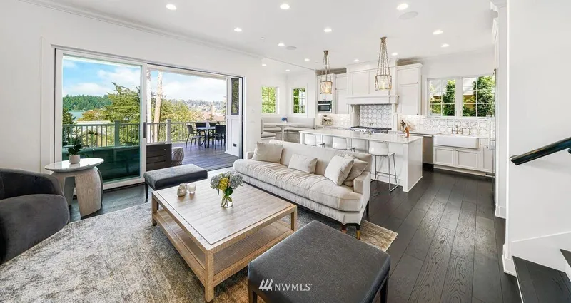 Mercer Island, Cape Cod: Living room opening to a deck beside the kitchen