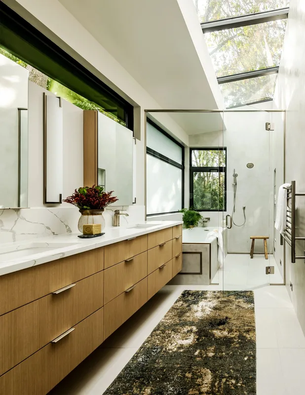 Mercer Island, indoor-outdoor: Bathroom with a long vanity and overhead windows