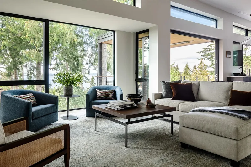 Mercer Island, indoor-outdoor: Living room with broad windows facing the trees