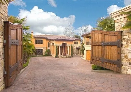 Mercer Island waterfront: Courtyard and front entrance beyond open wood gates