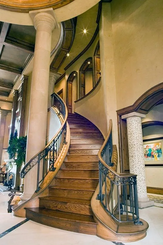 Mercer Island waterfront: Tall view of the curved staircase and entry columns