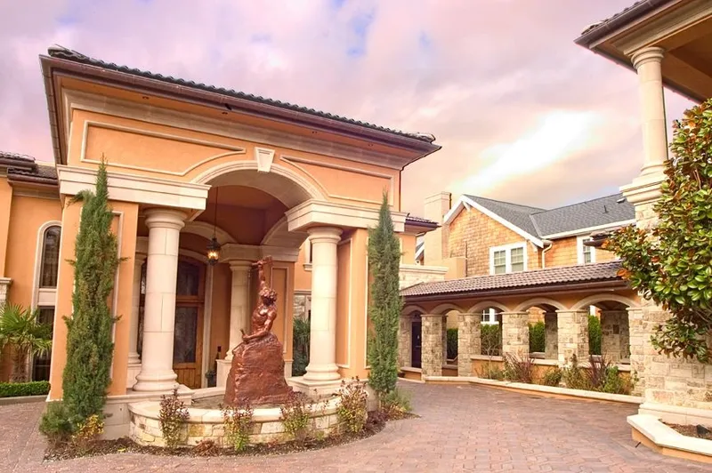 Mercer Island waterfront: Columned front entrance and fountain at dusk