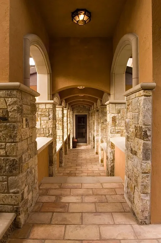 Mercer Island waterfront: Long covered passage with stone columns and paving
