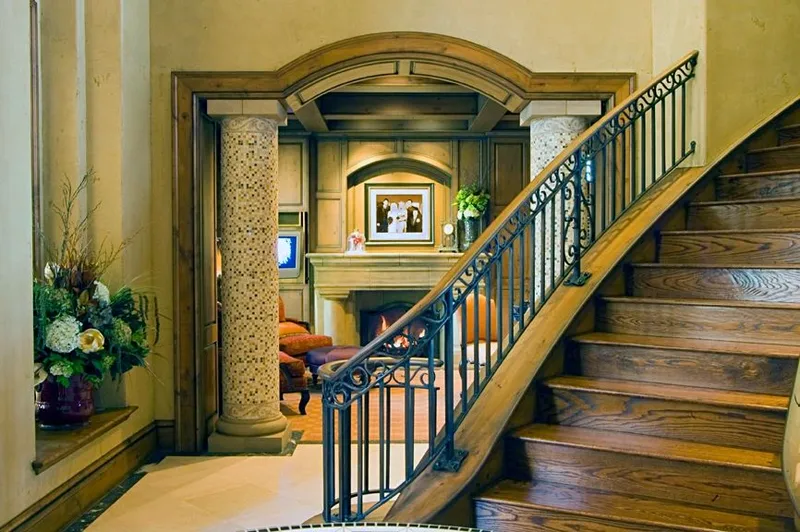 Mercer Island waterfront: Staircase beside an arched opening and decorative columns