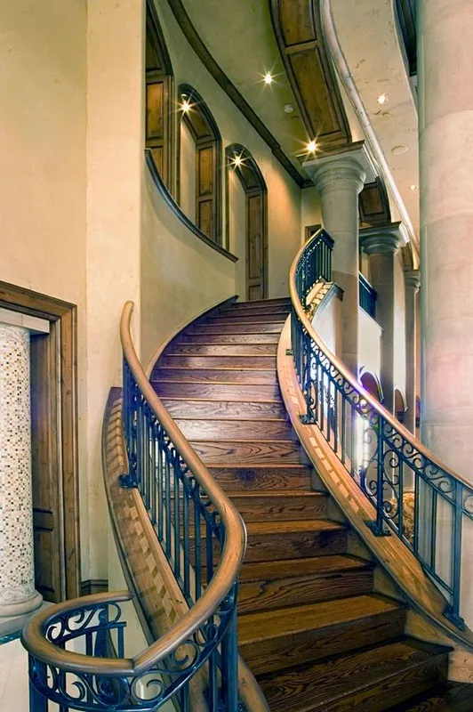 Mercer Island waterfront: Wood stair treads and iron railing beside the entry columns