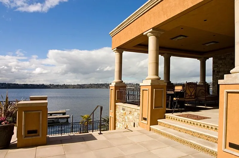 Mercer Island waterfront: Waterfront terrace beside a covered outdoor sitting area