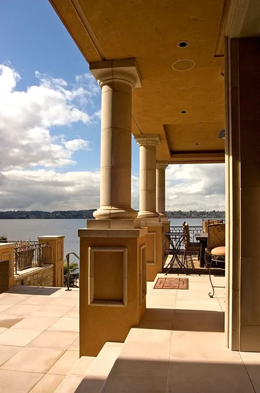 Mercer Island waterfront: Covered terrace with columns and a view of the water