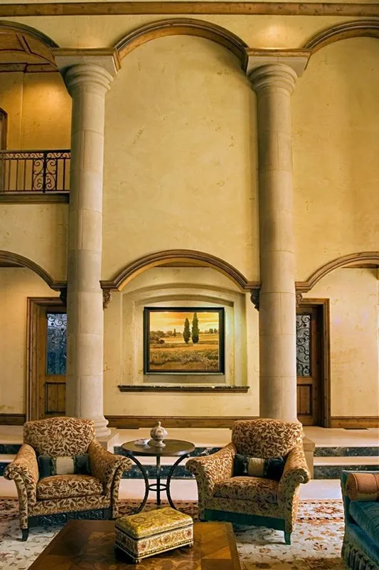 Mercer Island waterfront: Sitting area framed by columns and an arched fireplace wall