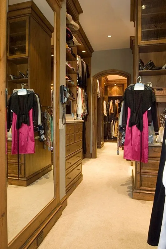 Mercer Island waterfront: Walk-in closet with glass-front storage and hanging rails