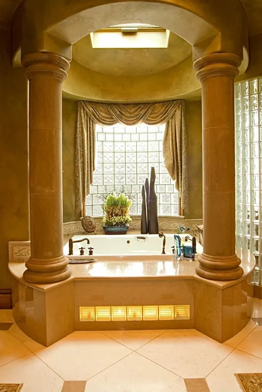 Mercer Island waterfront: Column-framed tub alcove with a glass-block window