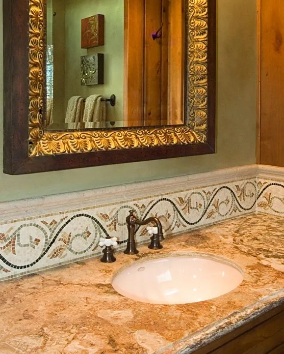 Mercer Island waterfront: Bathroom vanity with a framed mirror and decorative tile