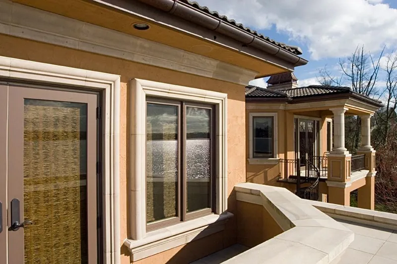 Mercer Island waterfront: Upper terrace beside glass doors and a columned balcony