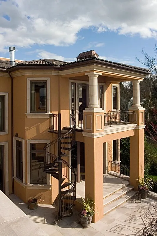Mercer Island waterfront: Rear corner of the home with stacked outdoor living areas