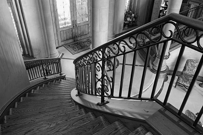 Mercer Island waterfront: Black-and-white view down the staircase toward the front door