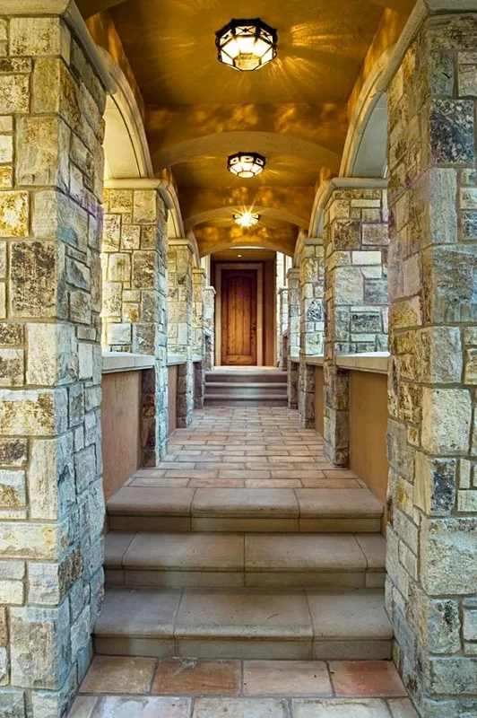 Mercer Island waterfront: Covered stone passage leading toward a wood door