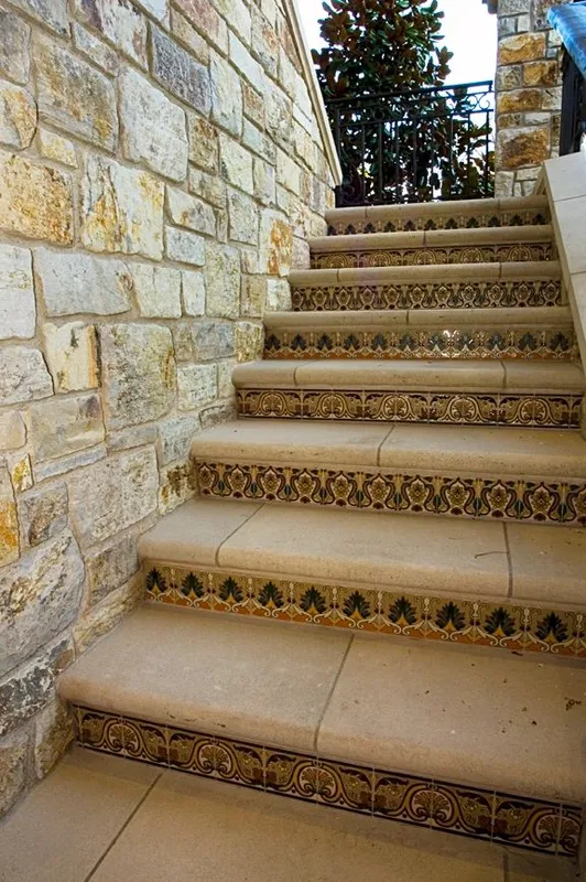 Mercer Island waterfront: Stone-sided exterior stairs with patterned tile risers