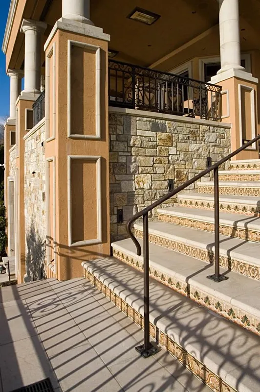 Mercer Island waterfront: Tiled exterior steps and iron railing beside the lower entry