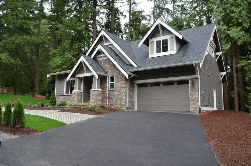 Redmond: Front exterior with gabled rooflines and a landscaped entry
