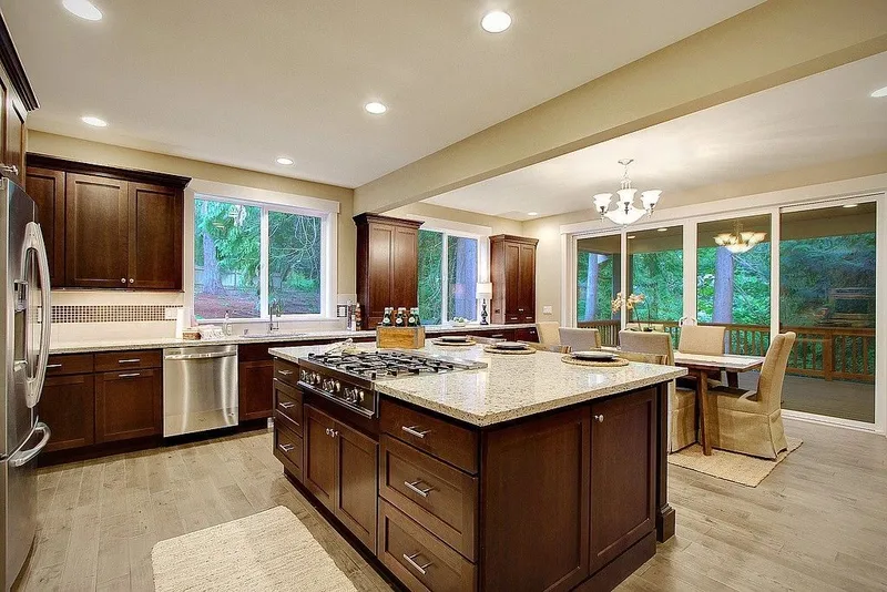 Redmond: Kitchen with a central island and wood cabinetry