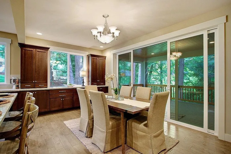 Redmond: Dining area beside windows and deck doors