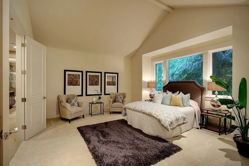 Redmond: Bedroom with a fireplace and vaulted ceiling