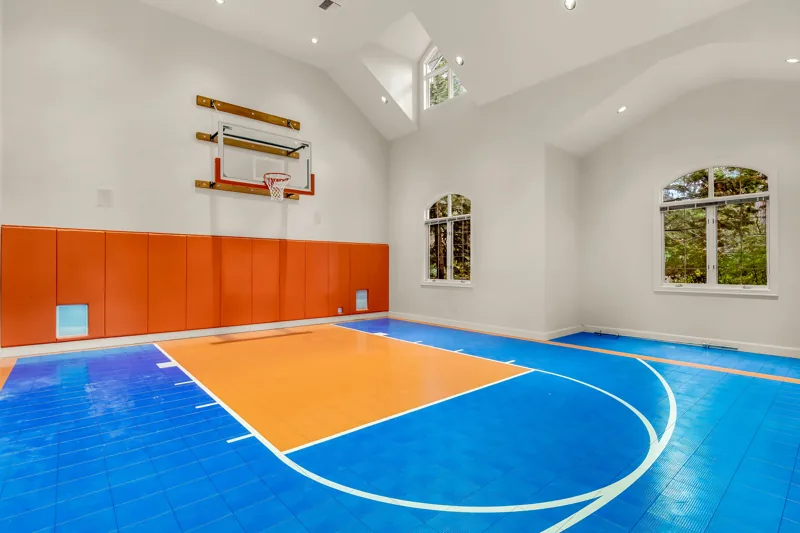 Indoor sports court with basketball hoops
